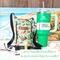 A green sushi print handmade bag, is pictured beside a Stanley 40 ounce Quencher, a pair of eye glasses, money, and chap stick.